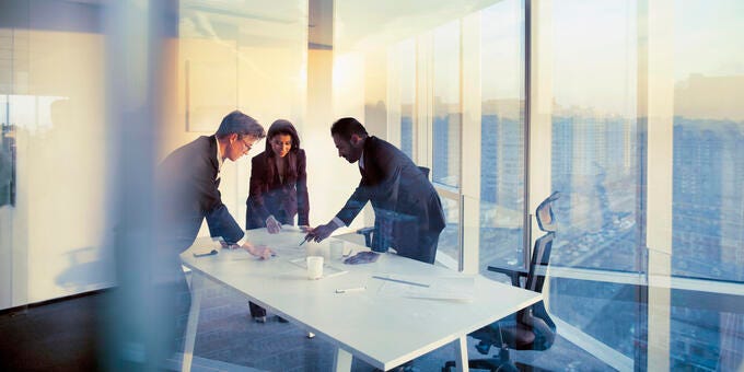 a group of people in a meeting