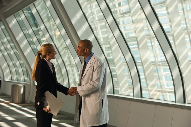 a man and a woman shaking hands
