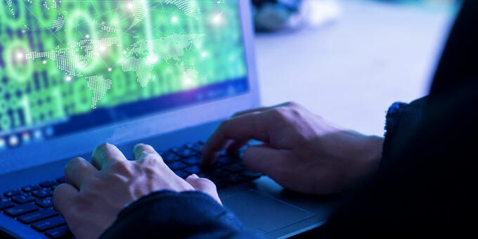 a person typing on a keyboard