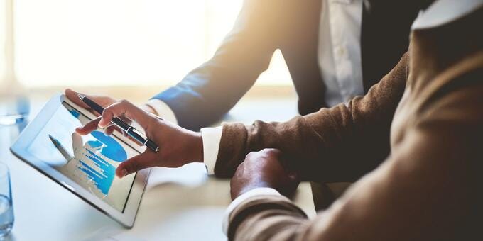 a person holding a tablet