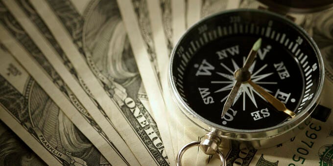 a clock on top of money