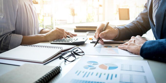 a few people working at a table