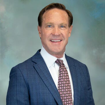 a man in a suit and tie