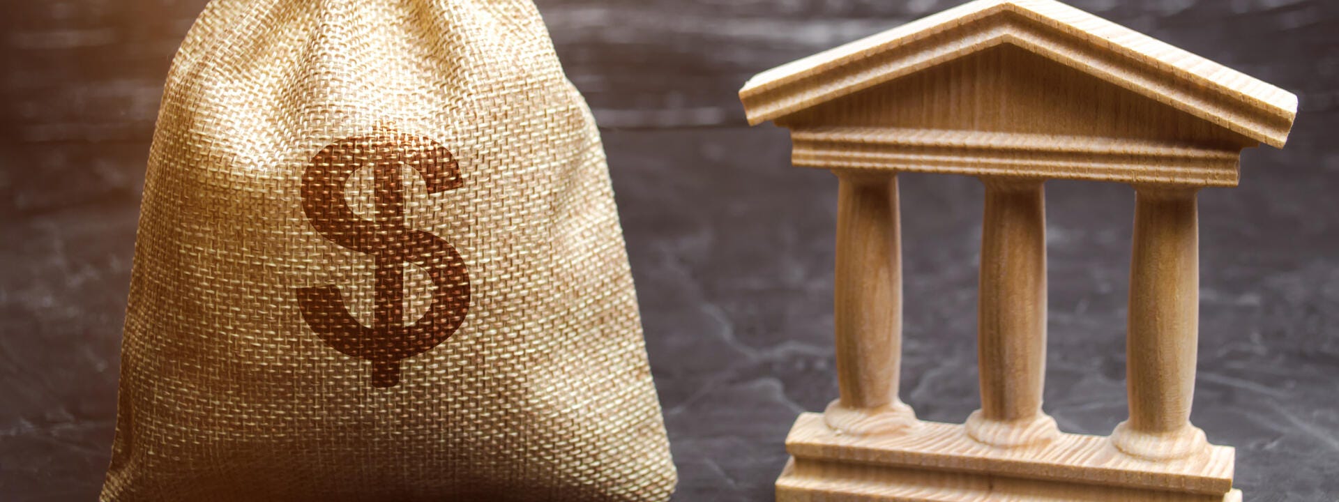 a wooden sculpture of a dog and a cat