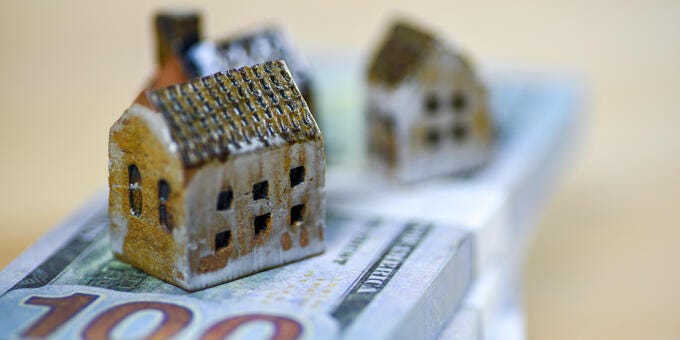 a group of cubes on a stack of paper money