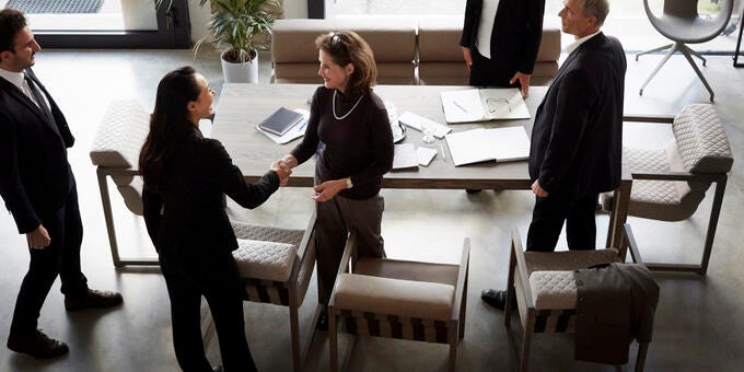 a group of people around a table