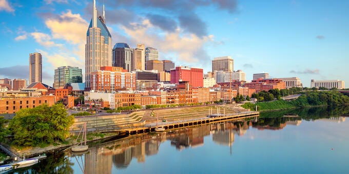 a city skyline with a river