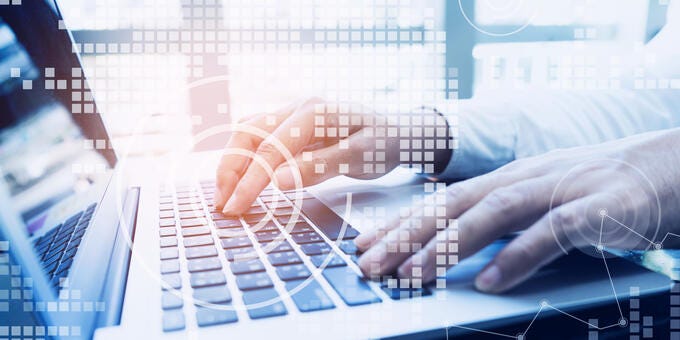 close-up of hands on a keyboard