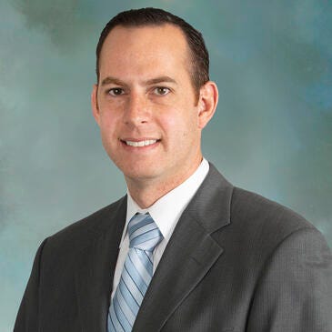 a man in a suit and tie