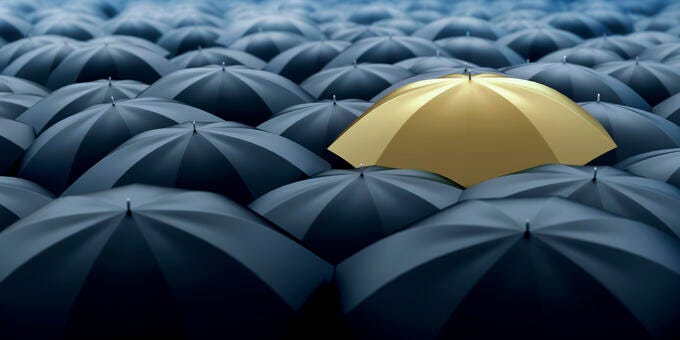 a yellow umbrella on a large white and blue background