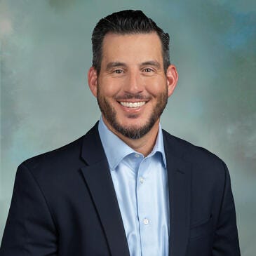 a man smiling for the camera