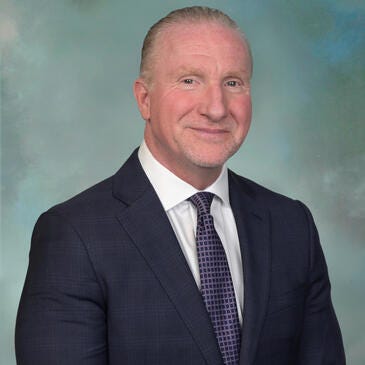 a man in a suit and tie