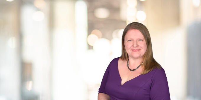 a woman in purple shirt