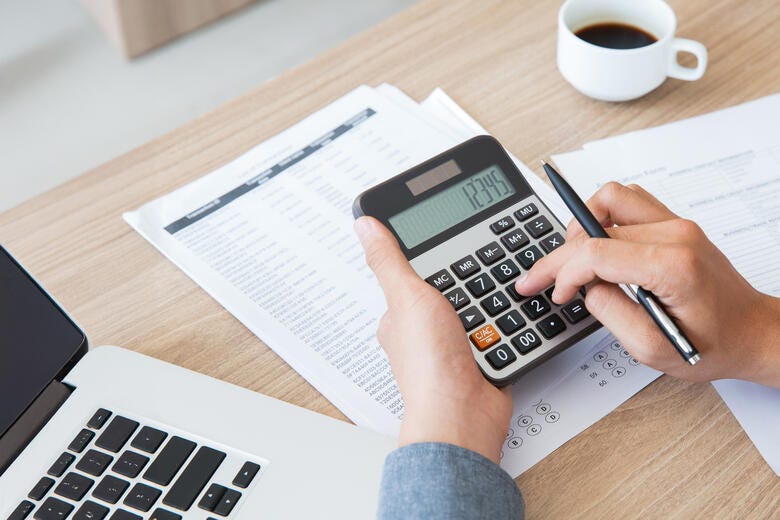 a person writing on a paper