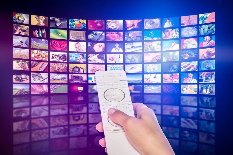 a person holds a remote control