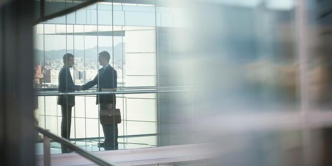 a few business people standing in a hallway