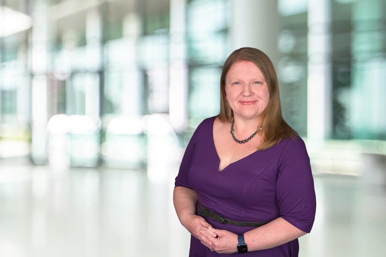 a woman with her arms crossed