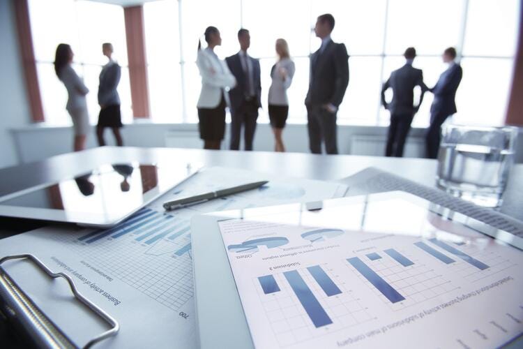 a group of people standing in a room