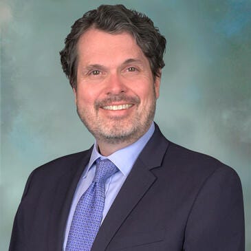 a man in a suit and tie