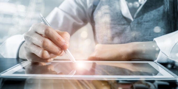 business man writing smart pad