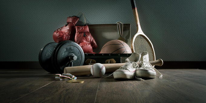 a pair of tennis shoes and a racket on a table