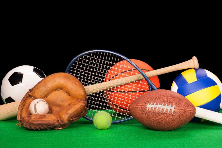 a group of balls and a racket on a table