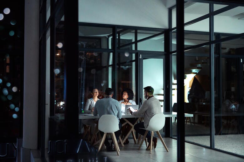 a group of people sitting at a table