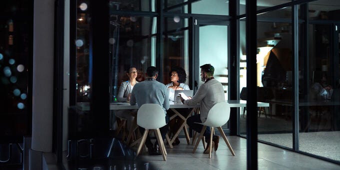 a group of people sitting at a table