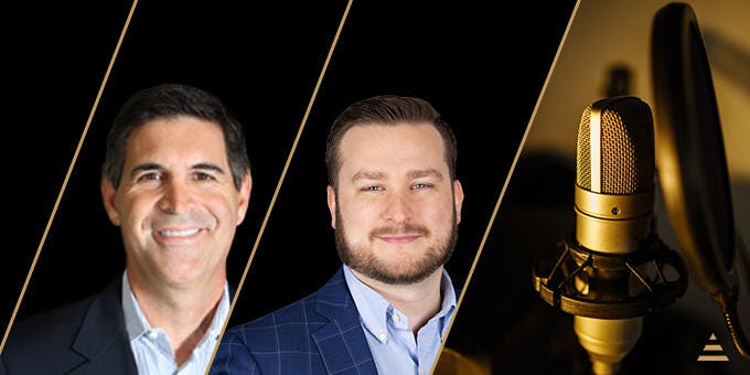 two men standing next to each other