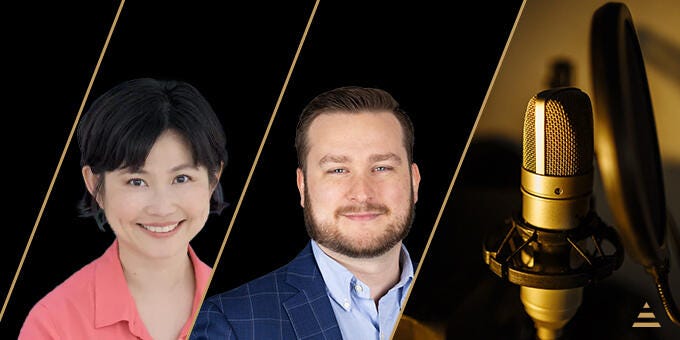 a man and woman standing next to a couple of guitars