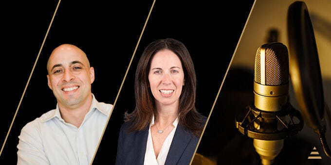 Jason Torres et al. standing next to a gold trophy