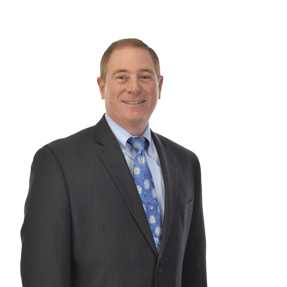 a man in a suit smiling