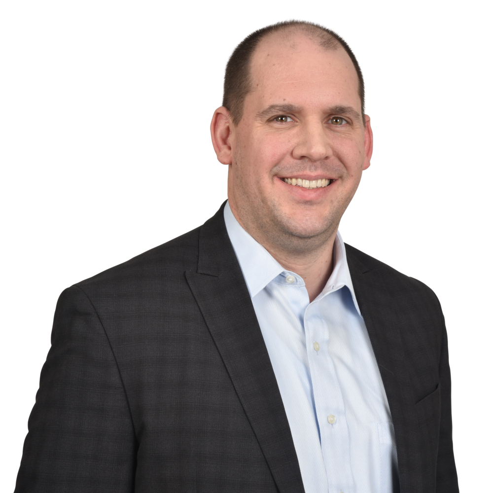 a man in a suit smiling