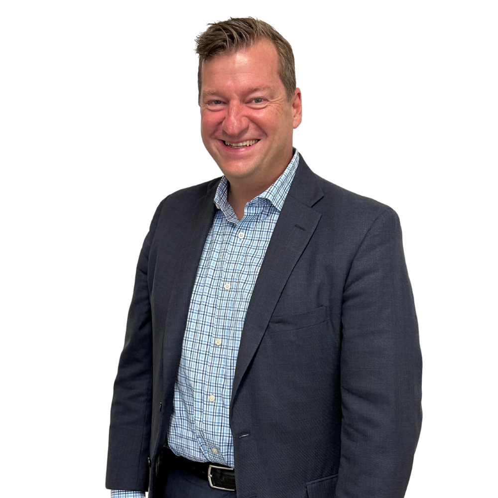 a man in a suit smiling