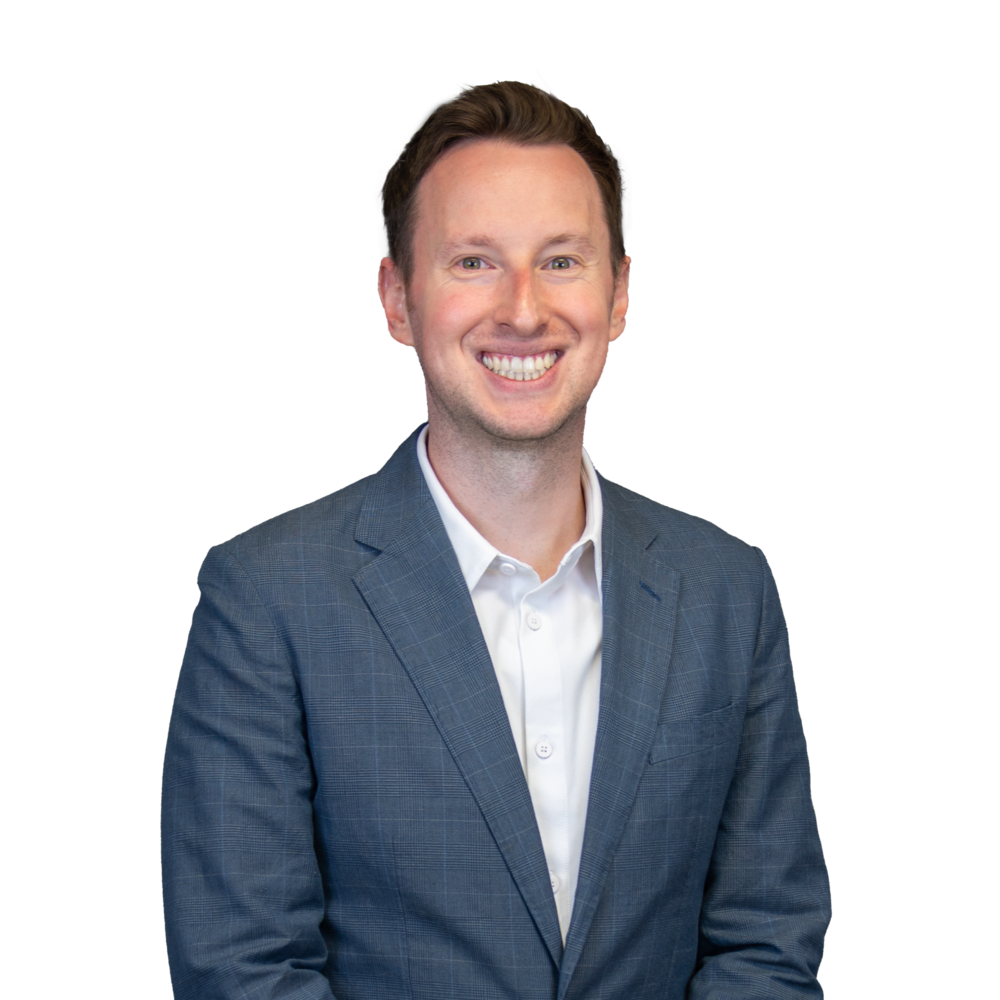 a man in a suit smiling