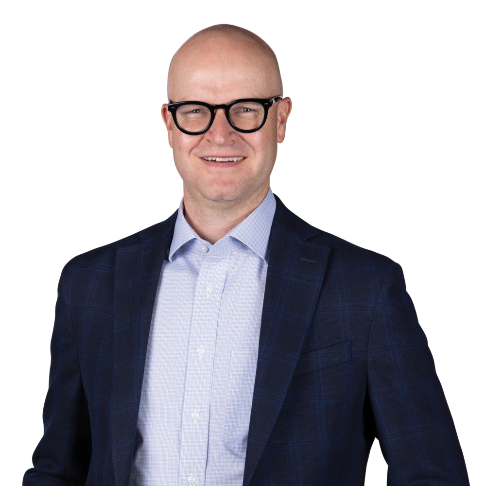 a man wearing a suit and glasses