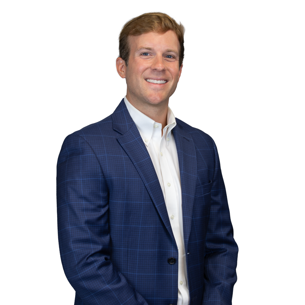 a man in a suit smiling